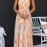 Vestido maxi con escote halter y espalda descubierta, cintura entallada, estampado en acuarela