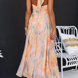 Vestido maxi con escote halter y espalda descubierta, cintura entallada, estampado en acuarela
