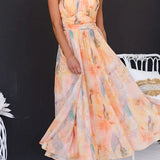 Vestido maxi con escote halter y espalda descubierta, cintura entallada, estampado en acuarela