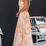Vestido maxi con escote halter y espalda descubierta, cintura entallada, estampado en acuarela