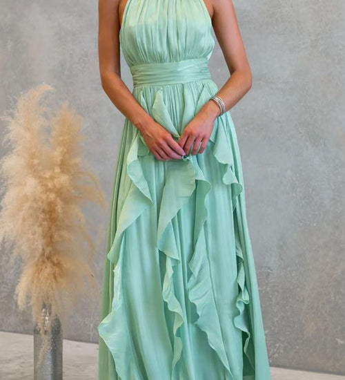 Vestido maxi con escote halter y volantes de caída fluida